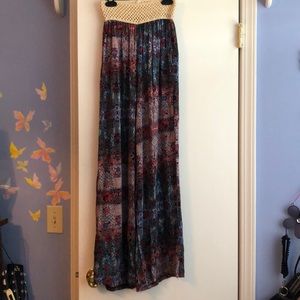Dark colored palazzo pants with a beige waistband